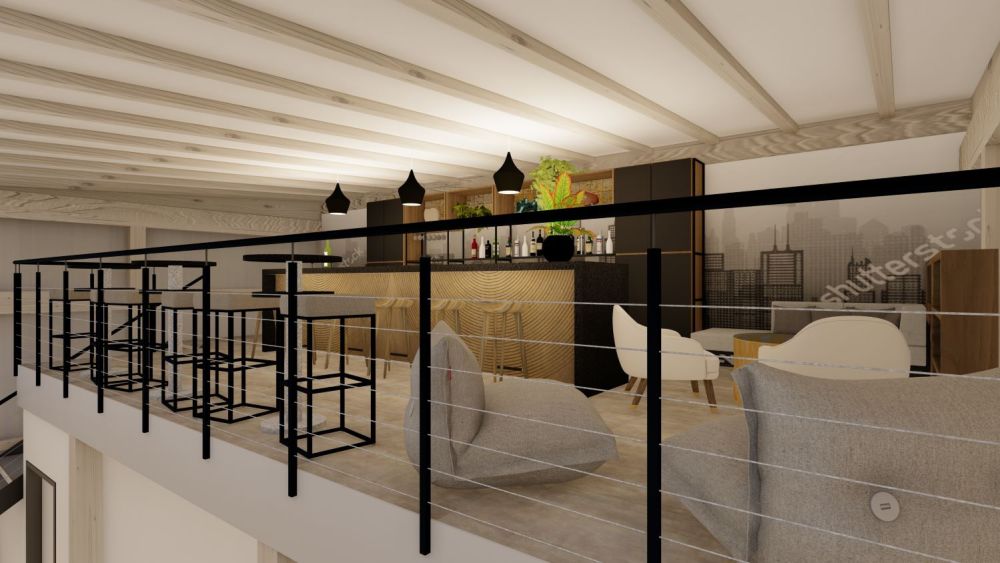 Blick auf die Galerieebene, ausgerichtet auf den gemütlich gestalteten Loungebereich. Die offene Struktur der Galerie betont die räumliche Weite, während der Loungebereich mit seinen Sitzmöglichkeiten eine einladende Atmosphäre für Pausen und informellen Austausch schafft.